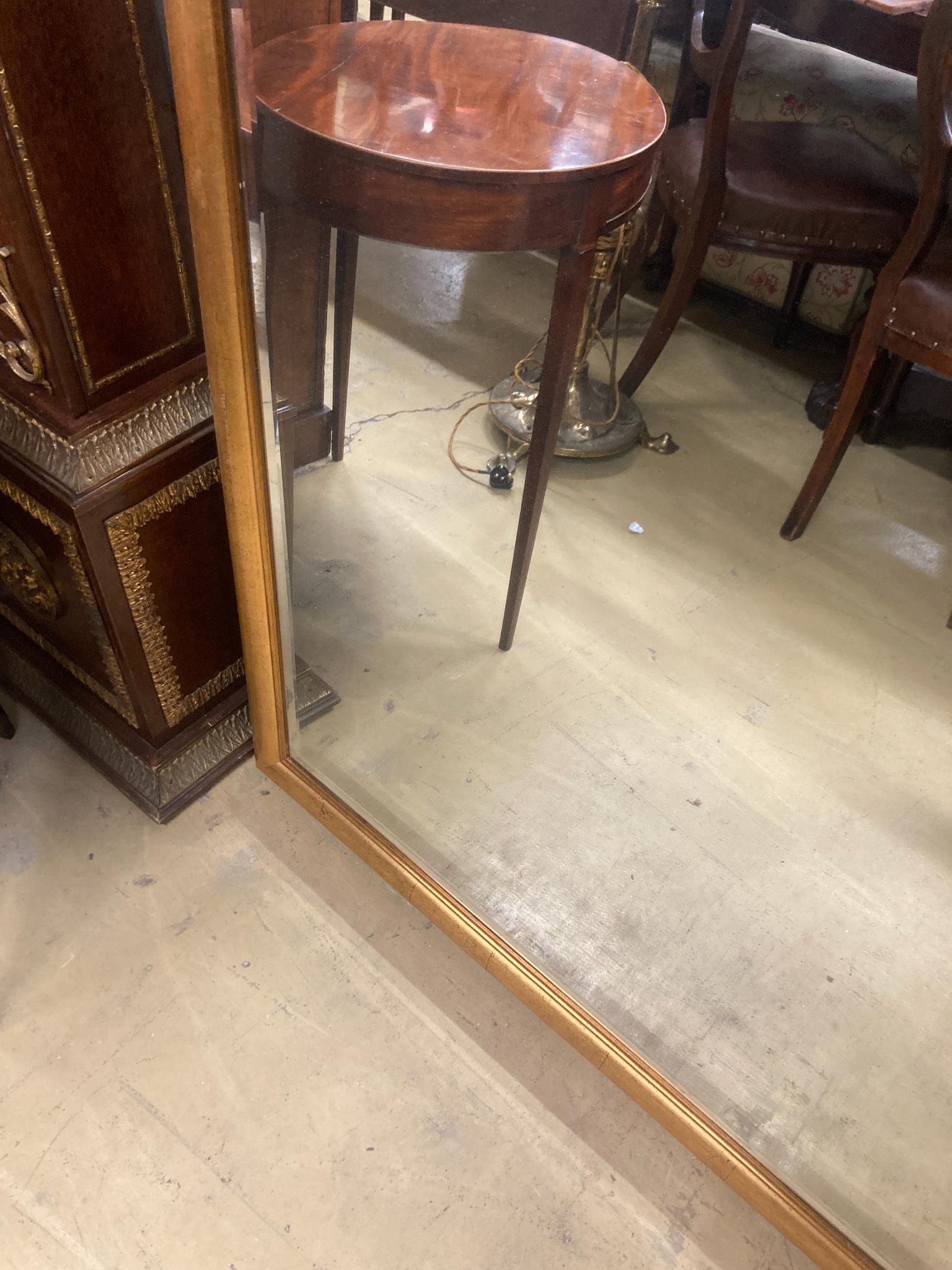 A contemporary rectangular gilt framed wall mirror, W.150cm H.96cm